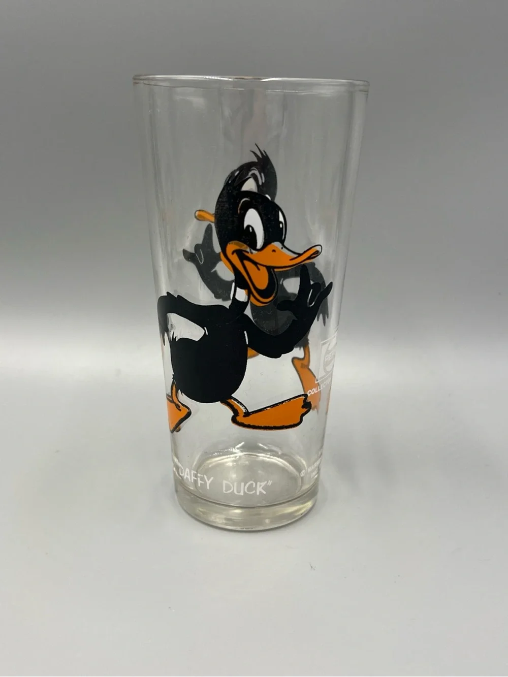 Pepsi Daffy Duck Clear Glass Tumbler with Black and Orange Artwork